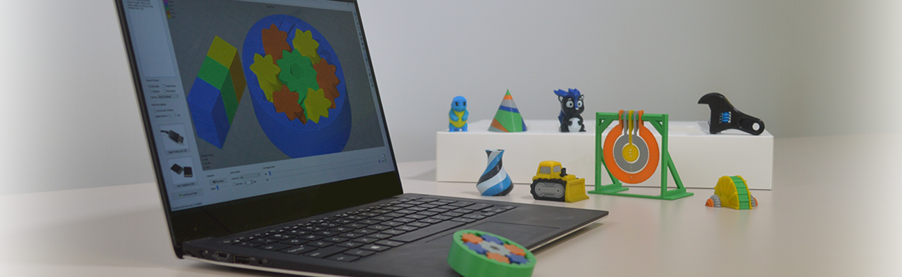 Simplify3D - multi-material 3D prints next to laptop