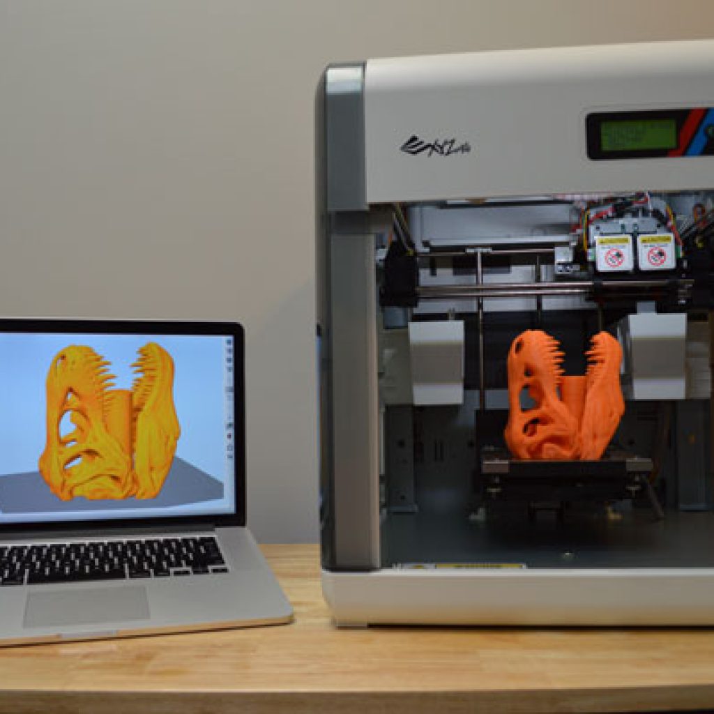 Simplify3D XYZprint da Vinci printer next to laptop